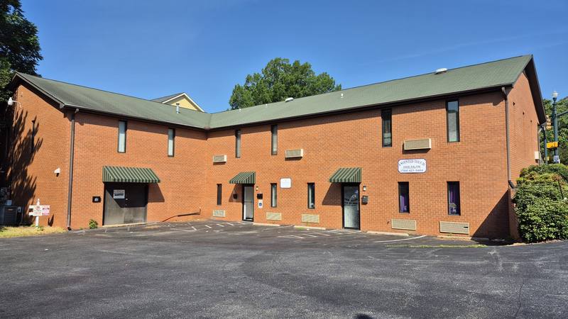 Annointed Touch salon 4 Spring St SW with Dermabeauty and building view Concord NC