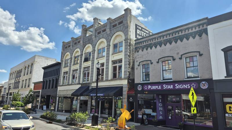 Pythian Building Purple Star Signs Hein Law Fit One on One Appointmint storefront 38 Union St S Concord NC