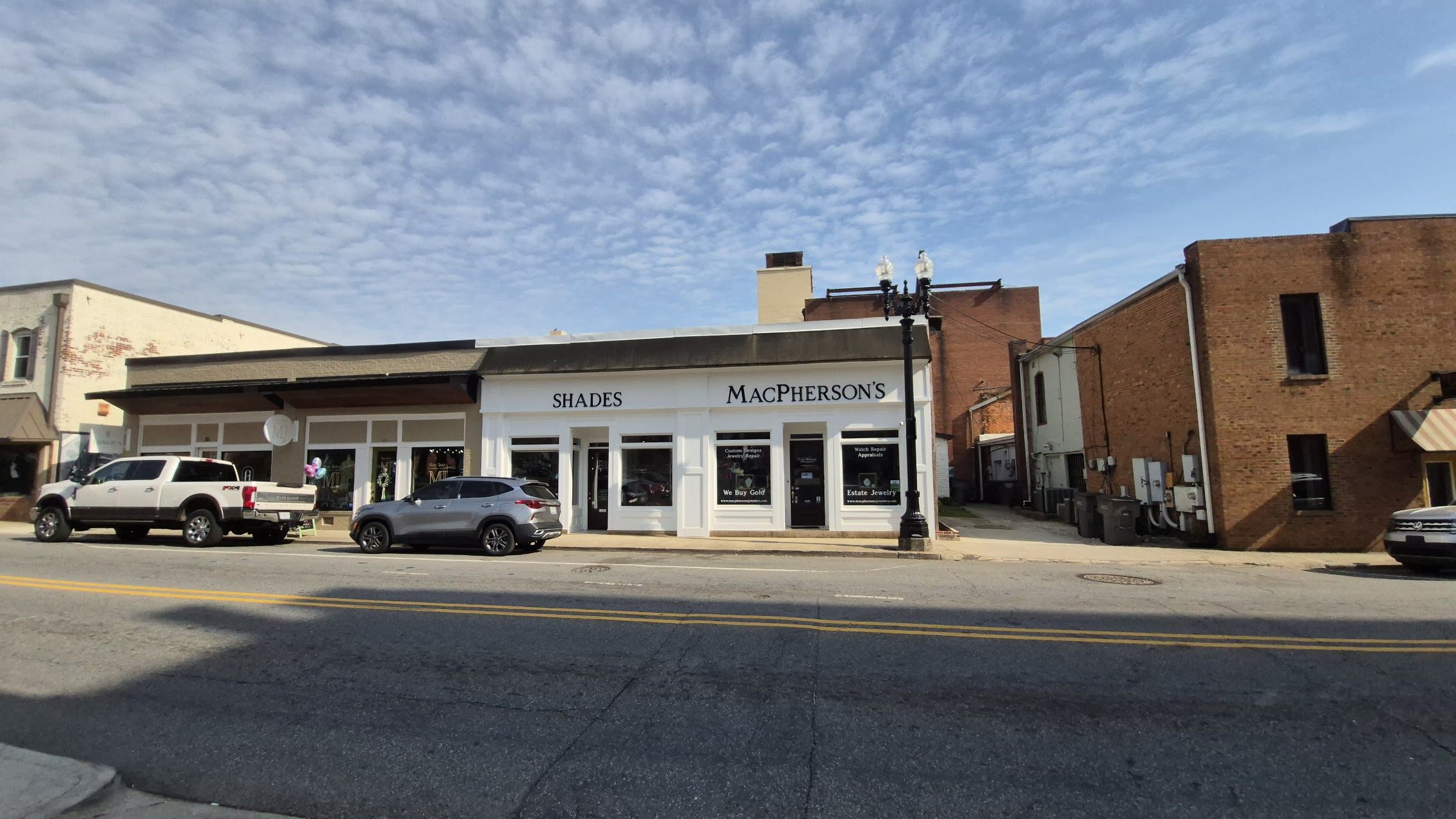 Shades MacPherson's storefront Cabarrus Ave