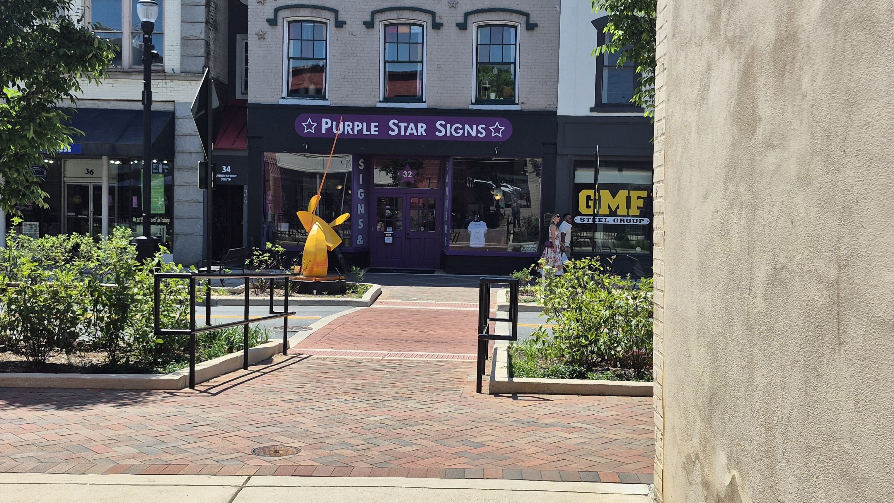Purple Star Signs storefront 32 Union St S downtown Concord NC